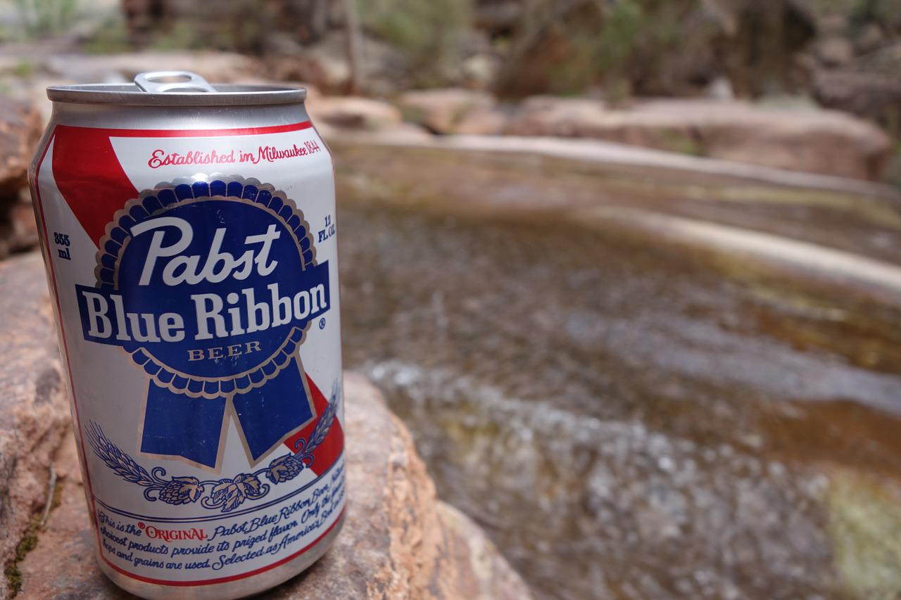 can of pabst blue ribbon outside on a boulder
