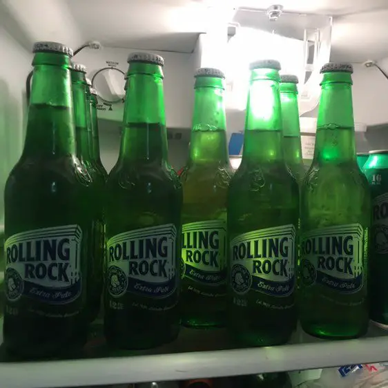 fridge full of bottles of rolling rock beer
