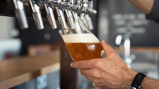A pilsner being poured from the tap.