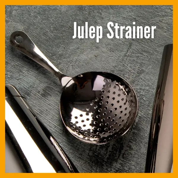 A Julep Strainer on a table.