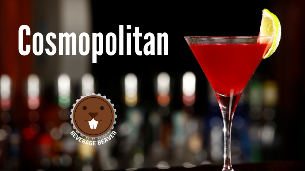A Cosmopolitan Cocktail on a bar with a blurry background.