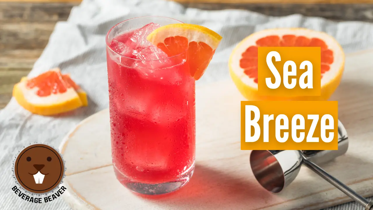 A Sea Breeze Cocktail garnished with a slice of grapefruit.