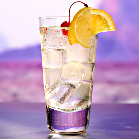 A Vodka Collins Cocktail on a purple background
