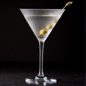 A Vodka Martini cocktail on a black background.