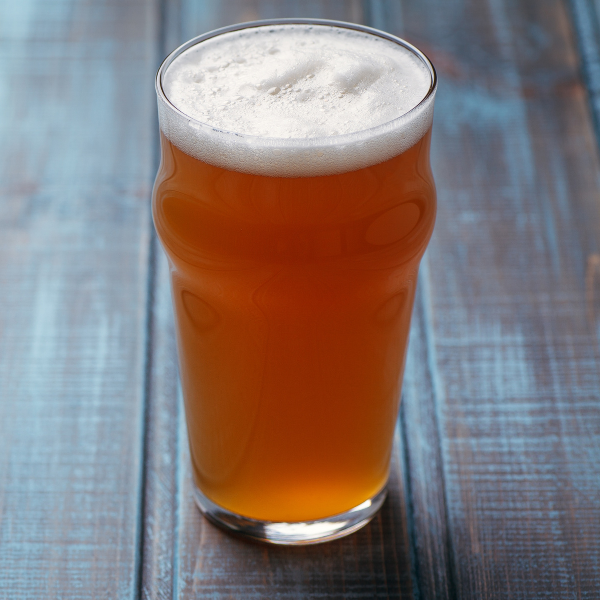 A pale Ale On a table.