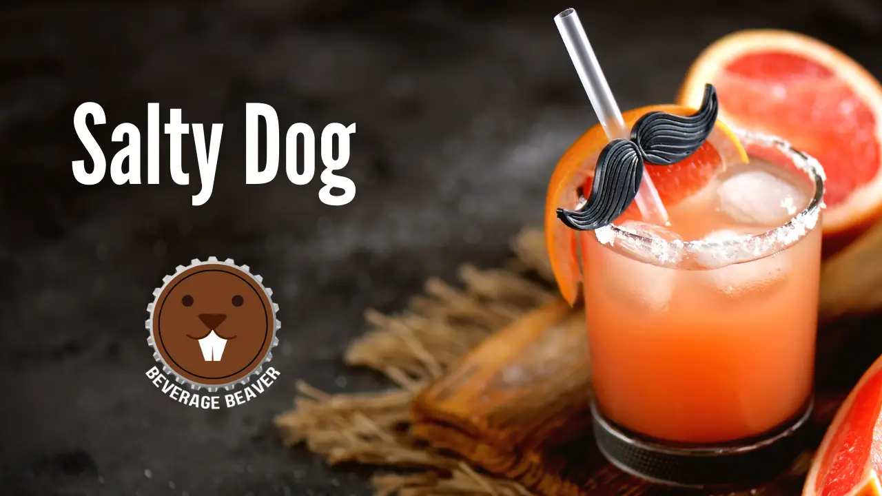 A salty dog cocktail on a black background