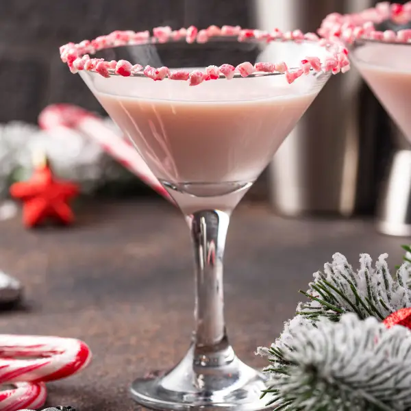 A close up of a Christmas Cocktail in a martini glass.