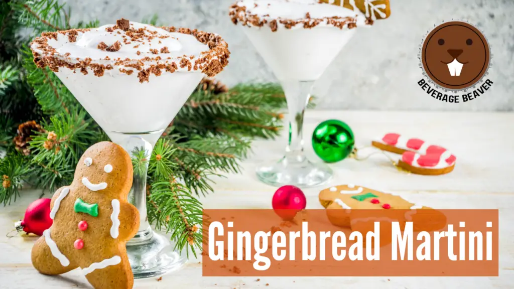 A close up o a gingerbread martini with a gingerbread man leaning up agains the glass.