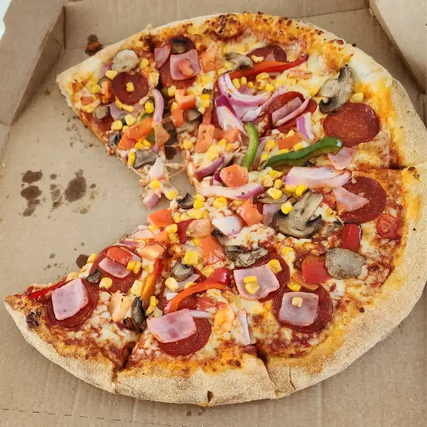A Meat Feast Pizza in a pizza box
